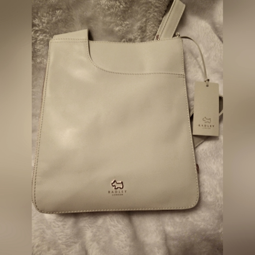 White Leather "Pockets Purse" with Rose gold color hardware by Radley London